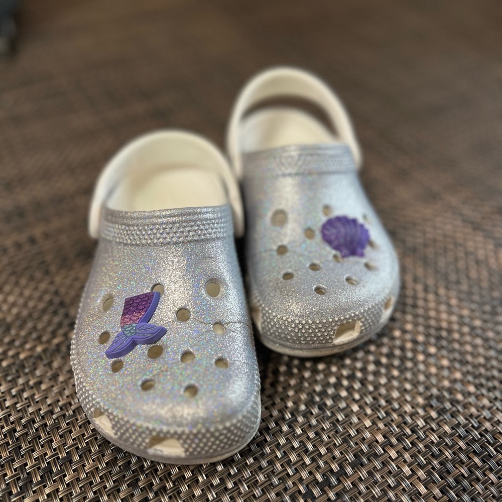 Crocs silver glitter shoes with two mermaid charms
